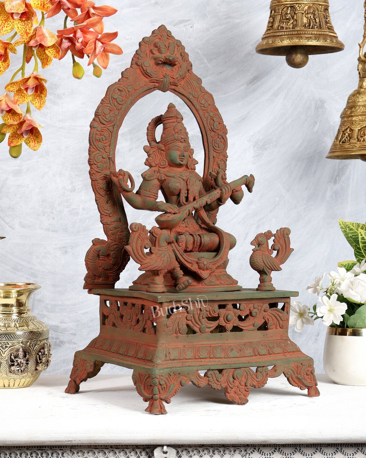 Vintage Brass Goddess Saraswati on Mayur Aasan – Dual Peacock Singhasan, Antique Green & Pink Sand Finish (20.5 Inches) - Budhshiv.com