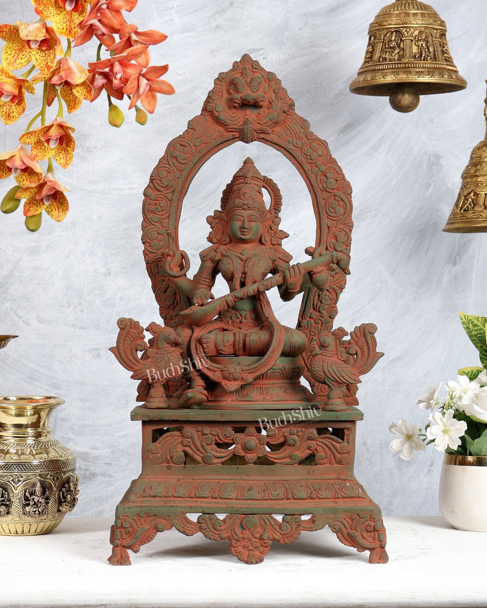 Vintage Brass Goddess Saraswati on Mayur Aasan – Dual Peacock Singhasan, Antique Green & Pink Sand Finish (20.5 Inches) - Budhshiv.com