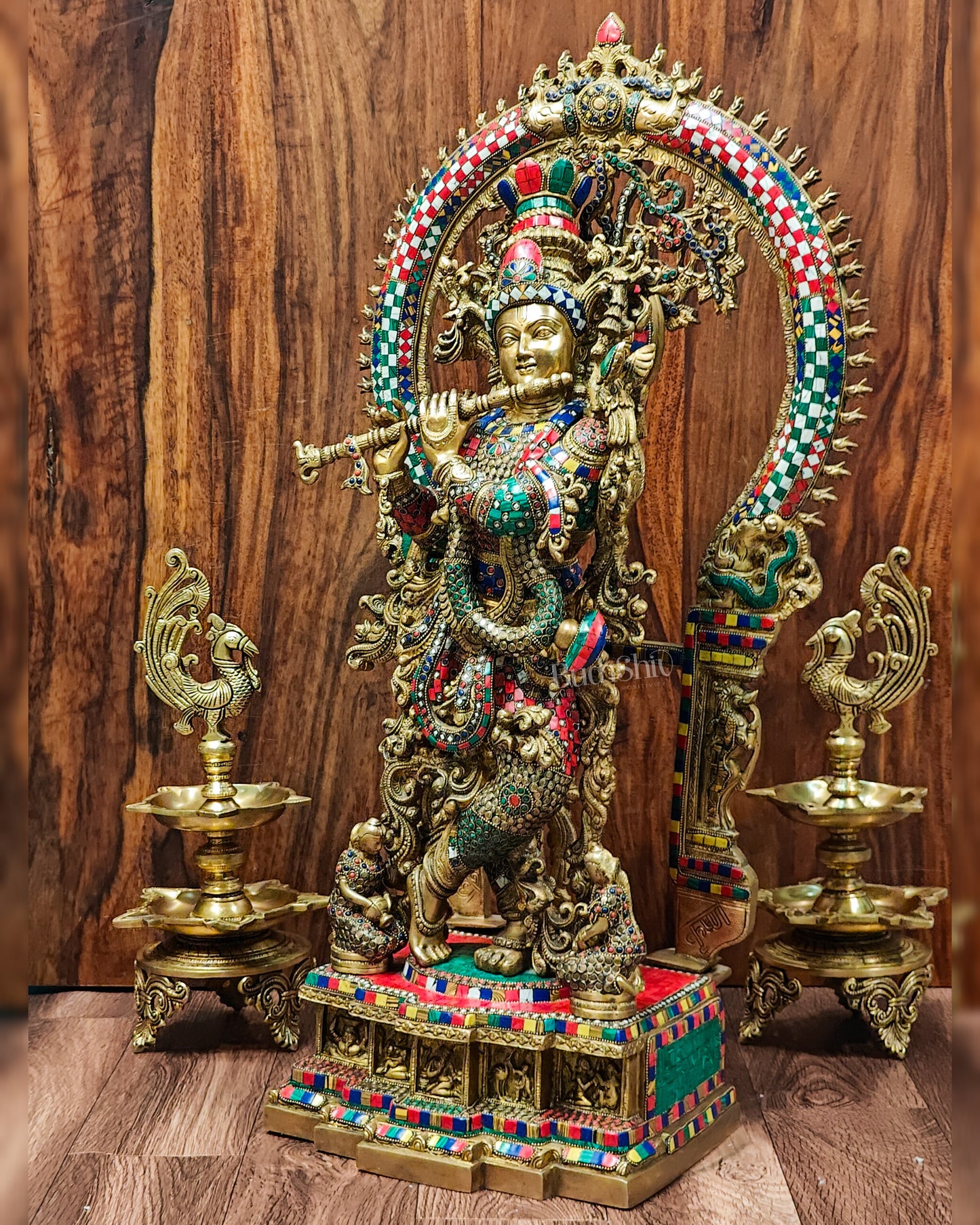 Lord Krishna depicted in pure brass with divine grace and stonework embellishments height 32 inch