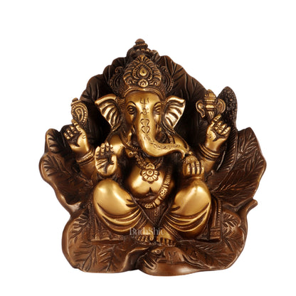 Beautifully Handcrafted Brass Ganapathi Statue Seated on Leaf Throne - 7" Height - Budhshiv.com