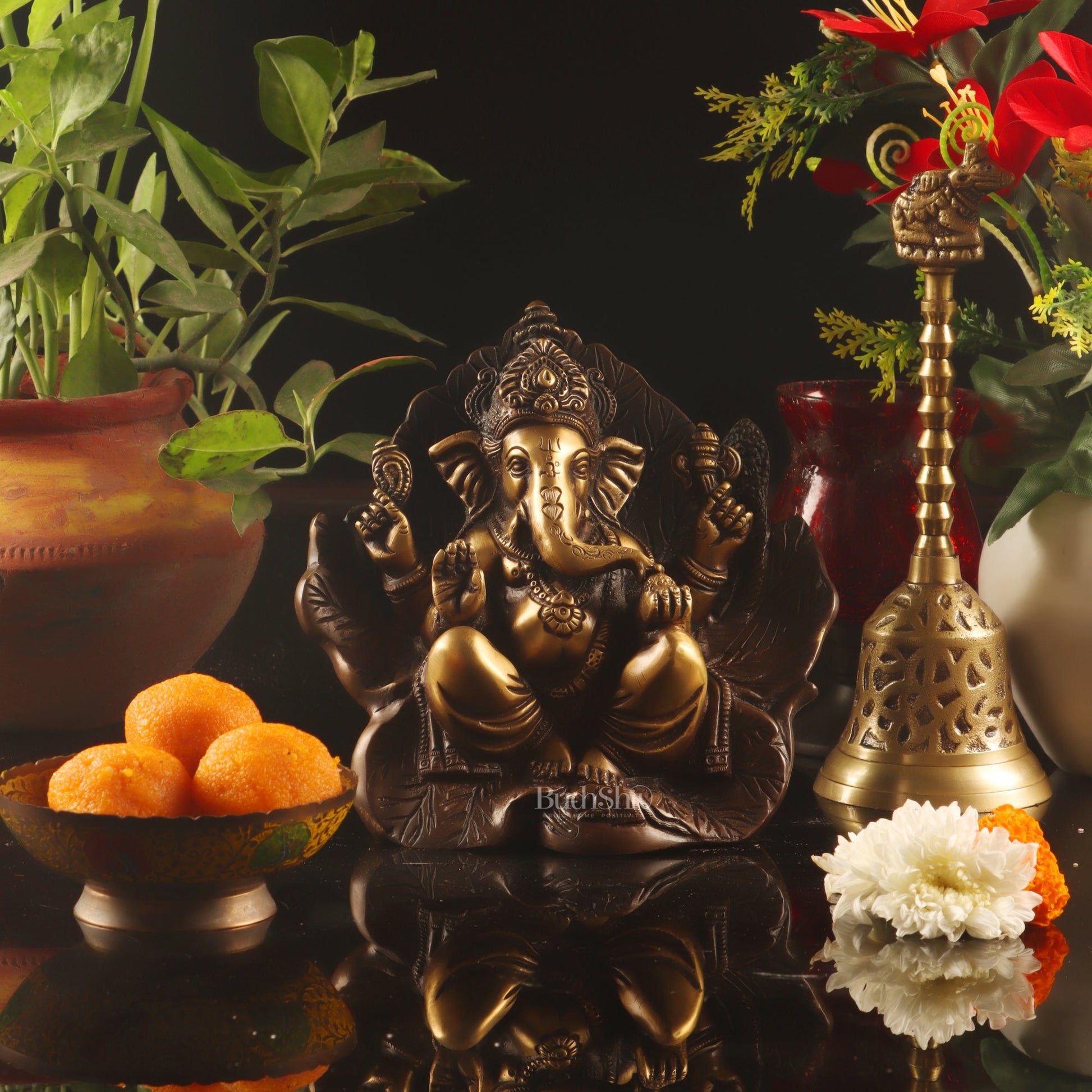 Beautifully Handcrafted Brass Ganapathi Statue Seated on Leaf Throne - 7" Height - Budhshiv.com