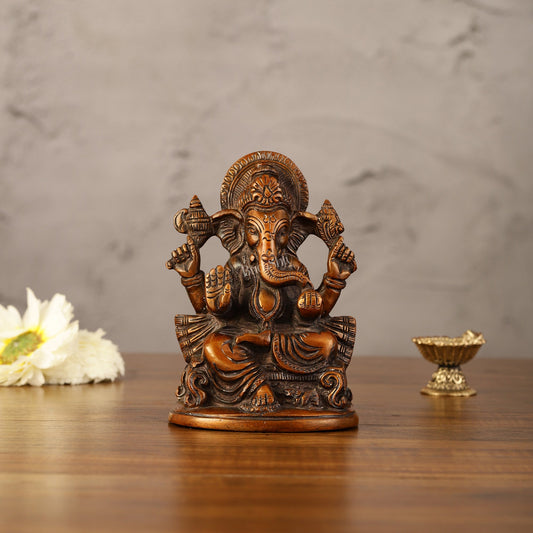 Brass Handcrafted Ganesha Idol Seated on Chair 5" - Budhshiv.com