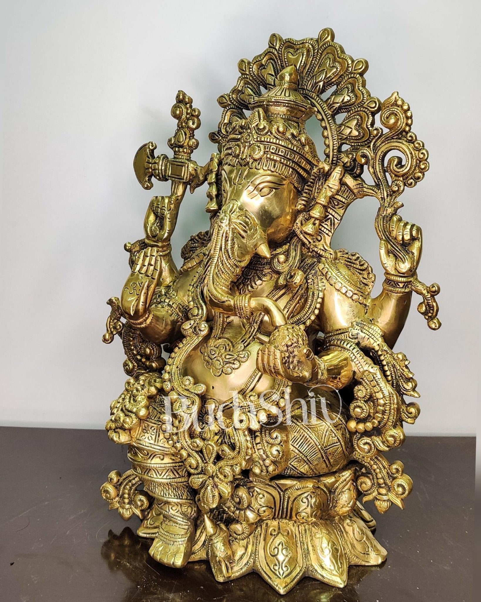Ganesha Brass Idol Ganapati Brass Idol with a unique trunk and four hands Ganesha brass statue16 inches - Budhshiv.com