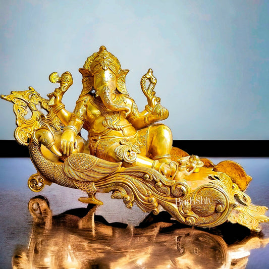 Handcrafted Brass Ganesha Resting on Peacock Bed | Divine Golden Finish 33" - Budhshiv.com